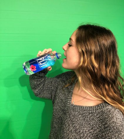 Piper Wood '21 drinking Fiji Water.