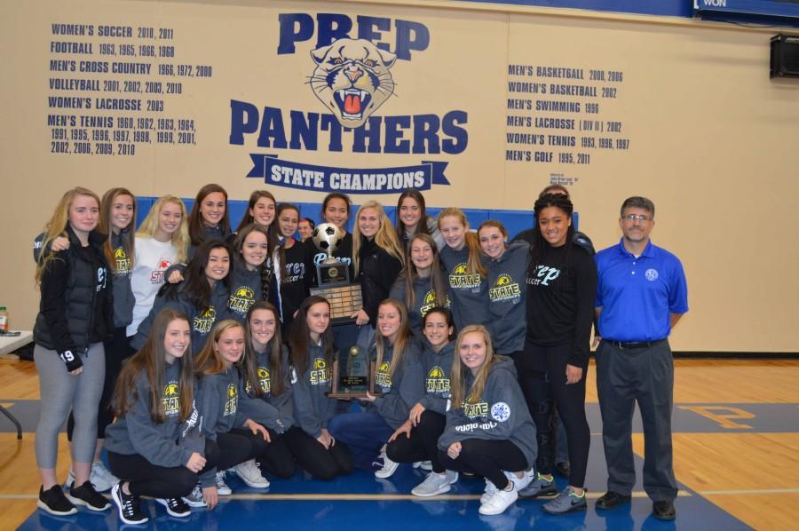 The girls soccer team poses with Coach Hendricks after winning 3A state title. Seniors Jalen Woodward and Sam Hiatt were named to the 2015 High School All-American West Coast Team.