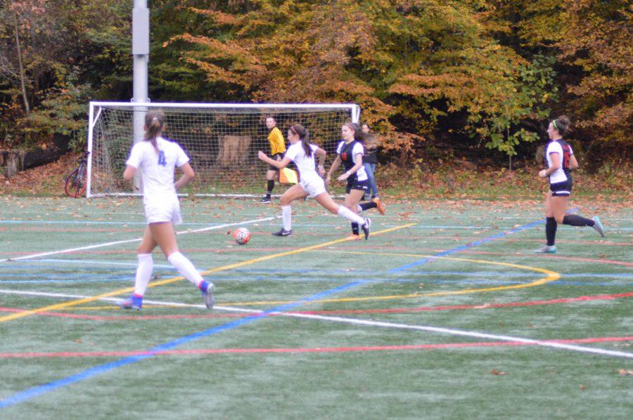 Sophie Hirst ‘18 on the Girls Soccer team dribbles the ball against Ballard High School defenders during the Metro quarter-final game. Prep Soccer is currently seeking to defend their 2015 State Championship title.