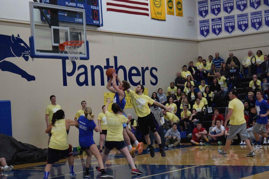 The faculty team, led by Mr. Throckmorton, upset the Senior class in Olympic Week basketball.