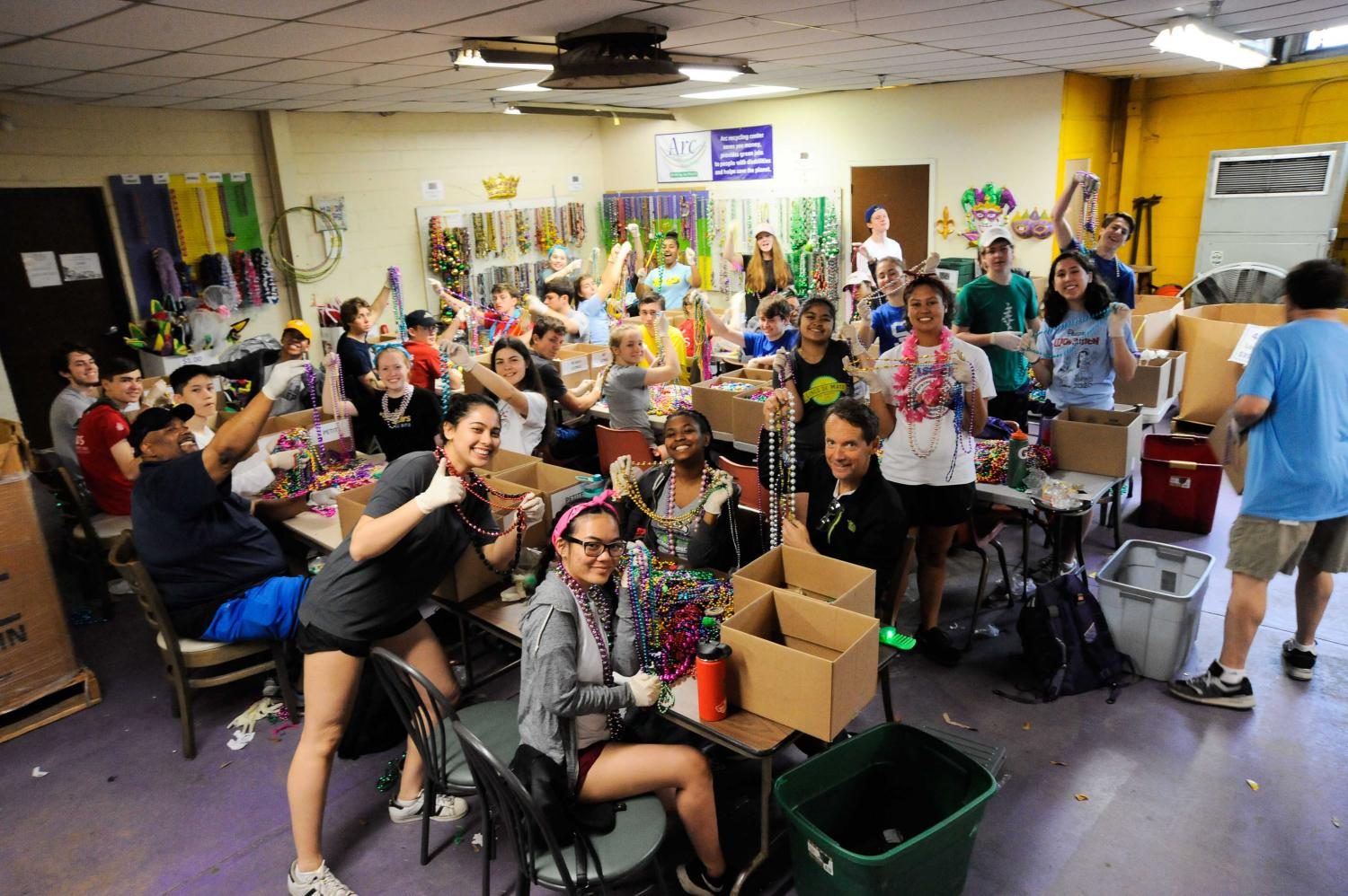 Prep+students+sorting+Mardi+Gras+beads+at+Arc+Mardi+Gras+recycling+in+New+Orleans.