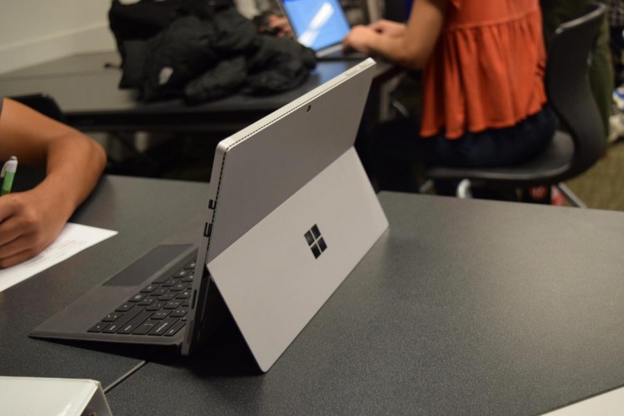 A+student+uses+their+Surface+to+complete+homework.+The+new+One-to-One+program+using+Microsoft+Surfaces+has+received+mixed+reactions+from+students.+