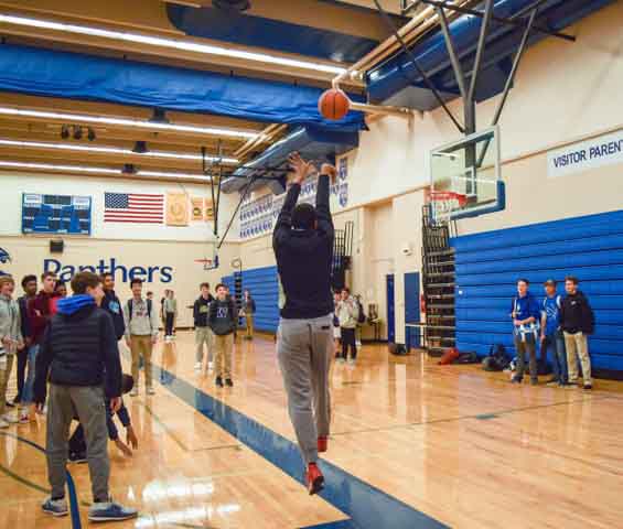 Rishi Daniels practices his jumpshot during intramurals. Intramurals gives Prep students a chance to compete on the court throughout winter.