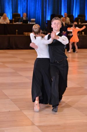 Aidan Wylie '22 dances at a recent competition. Wylie and other students find a creative outlet in ballroom and other dance styles.
