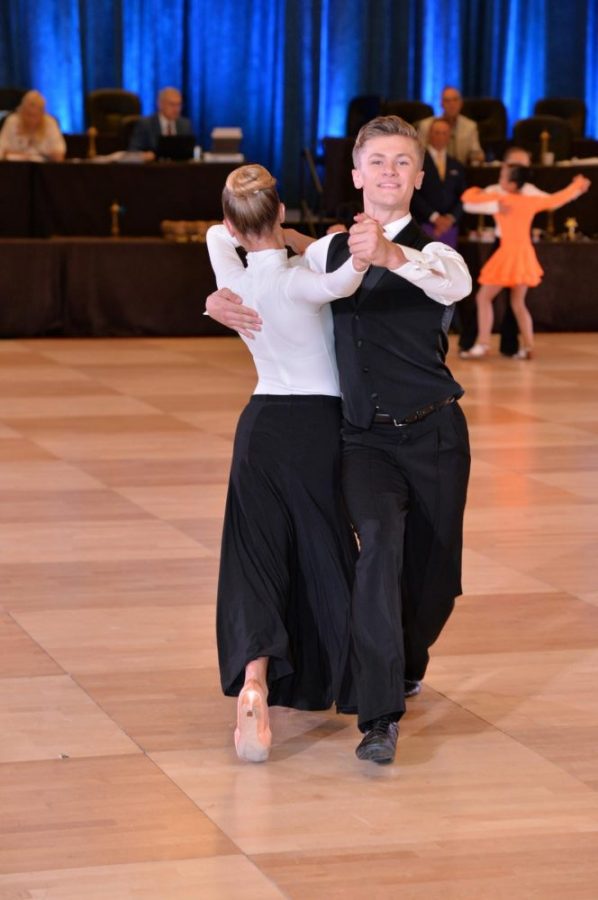 Aidan Wylie 22 dances at a recent competition. Wylie and other students find a creative outlet in ballroom and other dance styles.