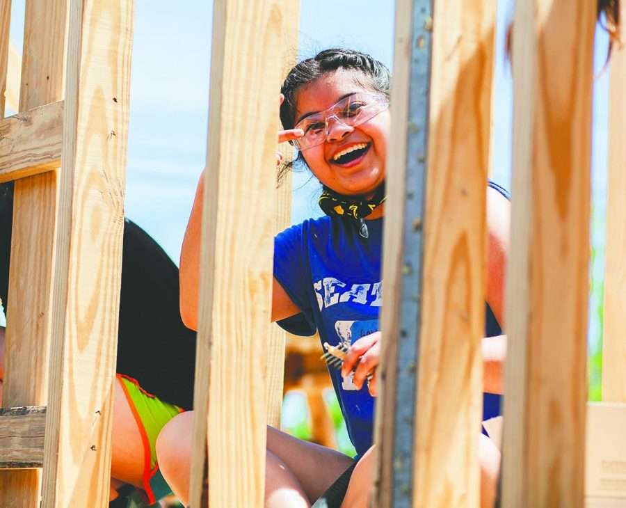 Gabby de la Pena 19 working on a home in New Orleans. De la Pena has attended the New Orleans service trip for three years, and was a leader for two of them.