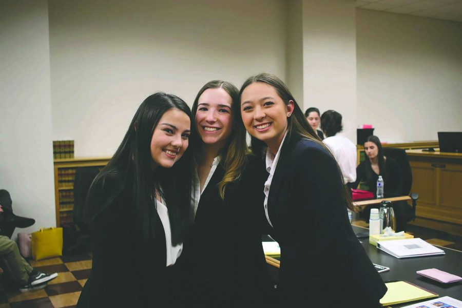 Seniors Marli Bosler, Maggie Waltner and Julia Oles pose after competing
at Mock Trial Districts. The team was scheduled to participate in the State
Competition which was canceled due to coronavirus concerns.