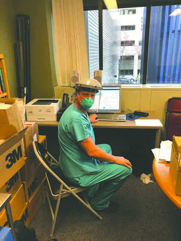 Anesthesiologist Doug Morgan uses personal
protective equipment while at work. Morgan is one of
many frontline workers combatting COVID-19.