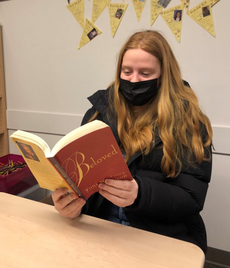 Junior Hannah DeGroot reads Beloved during Collegio