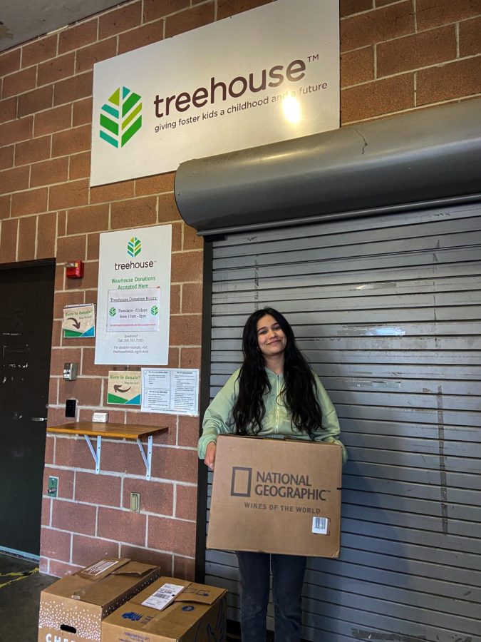 Natalie Aguilar Fox drops off boxes of donations for Treehouse.