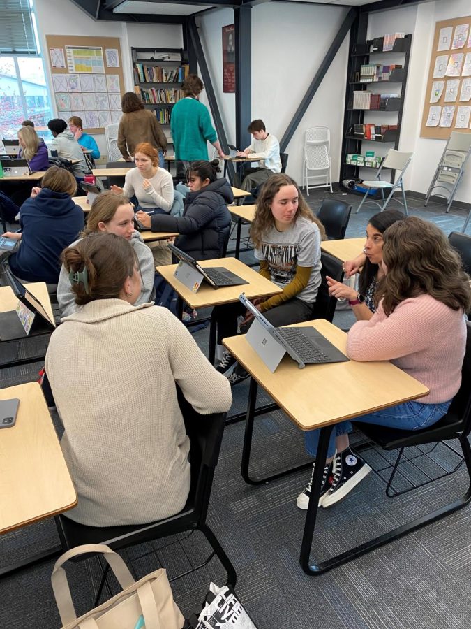 Mrs. Matthews works with a group of students in Disease and Social Responsibility. The class views global health issues through a theological lens.
