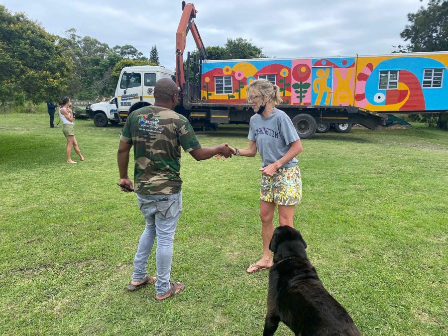 Shelly Neal ‘79 shakes hands with a local in South Africa. Neal and her husband Ralph Pooler have founded Reach! to help build pre-schools in rural South Africa.