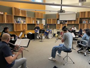 Jam Band practices during Window Period. The class offers students a chance to improve their musical skills in a casual and supportive environment.