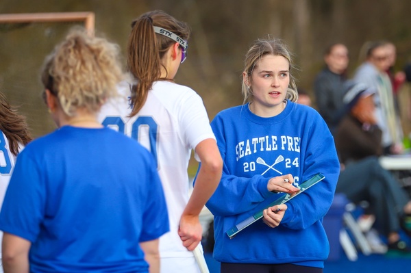 New Girls Lacrosse Coach Katie Brodsky on the sidelines during a recent practice. Brodsky boasts a stellar college career and has big goals for the team this season.