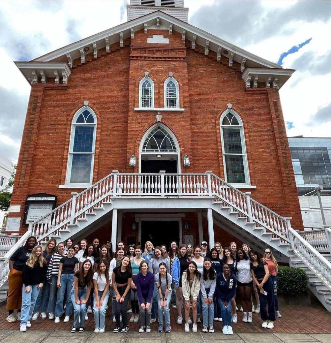 Students stand in front of the Dexter Avenue King Memorial Baptist Church in Montgomery, Alabama. Students on the Shirts Across America program visit a variety of historical sites and build houses.