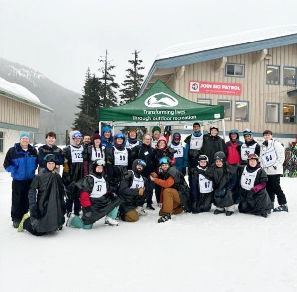Senior Max Hill volunteers with outdoor advocacy group Outdoors For All.