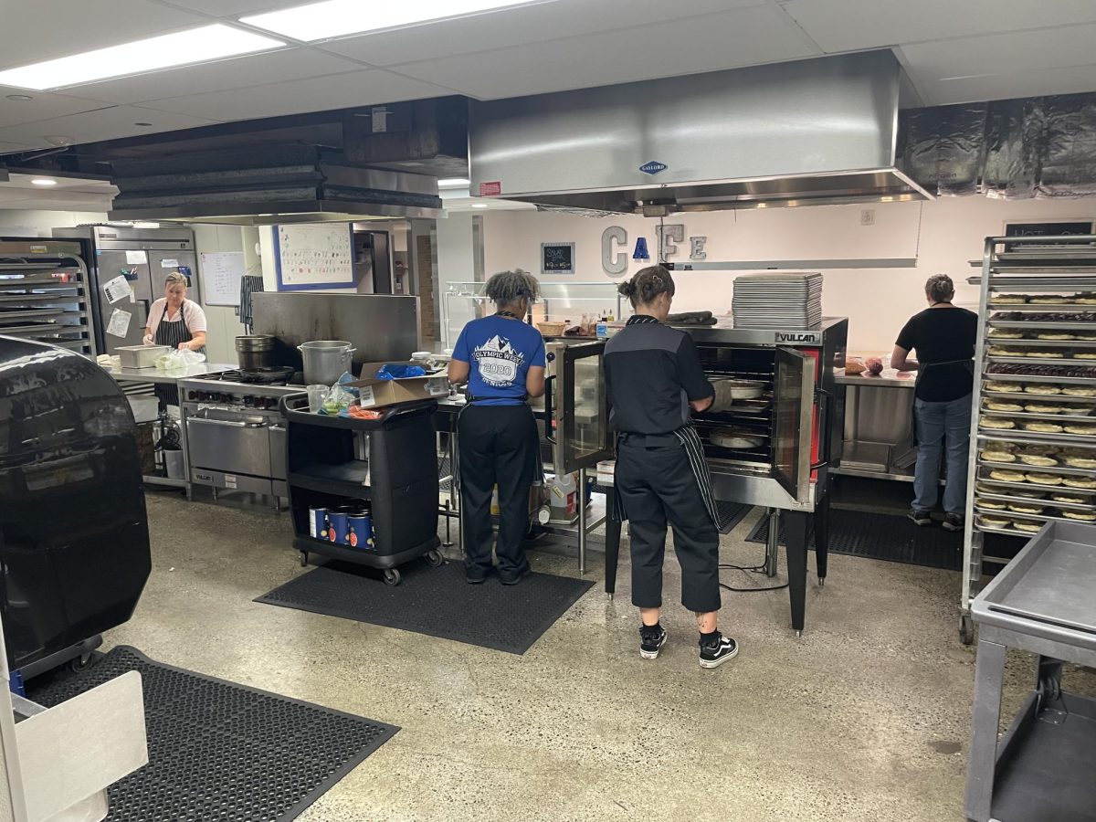 Chef Carter and the staff of the Smith Cafe prepare food before school.